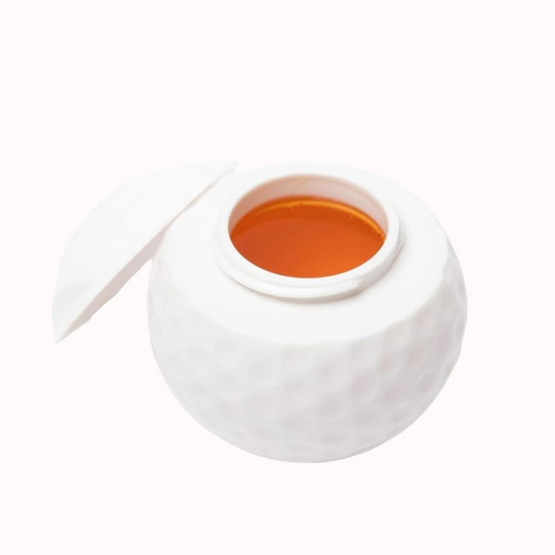 Kreativt shotglass formet som en golfball