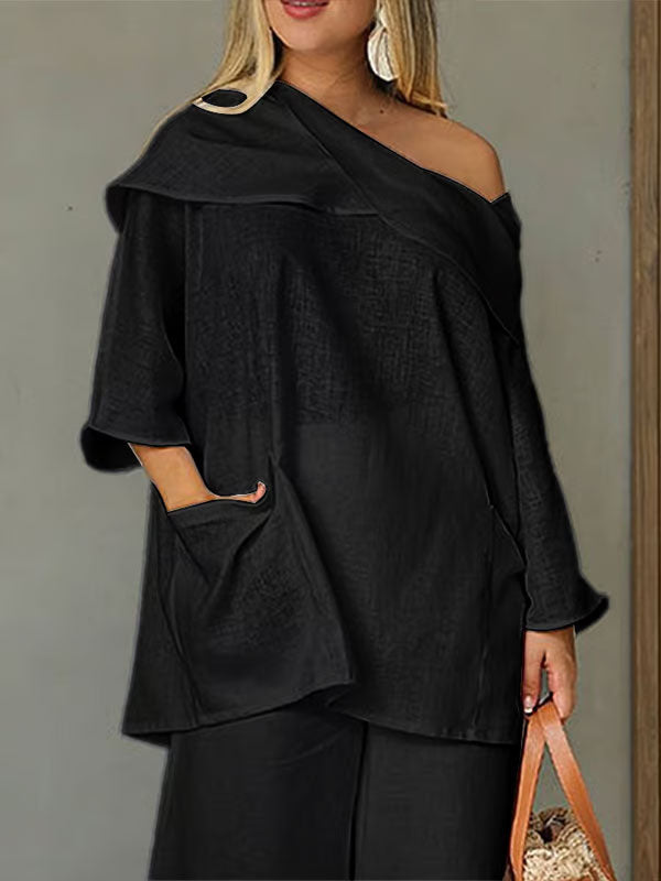 Dametopp med uregelmessig krage