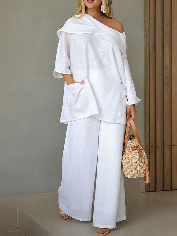 Dametopp med uregelmessig krage