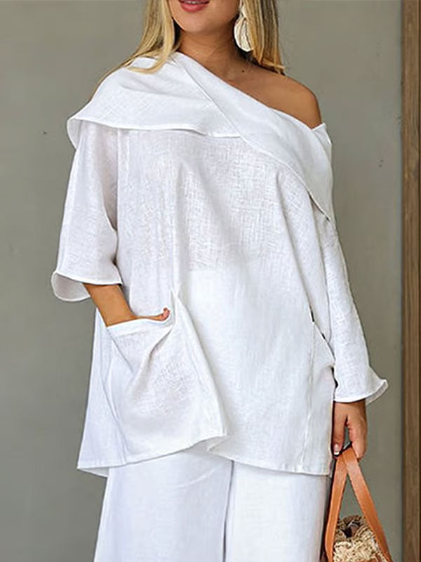 Dametopp med uregelmessig krage