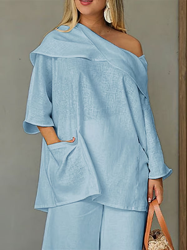 Dametopp med uregelmessig krage