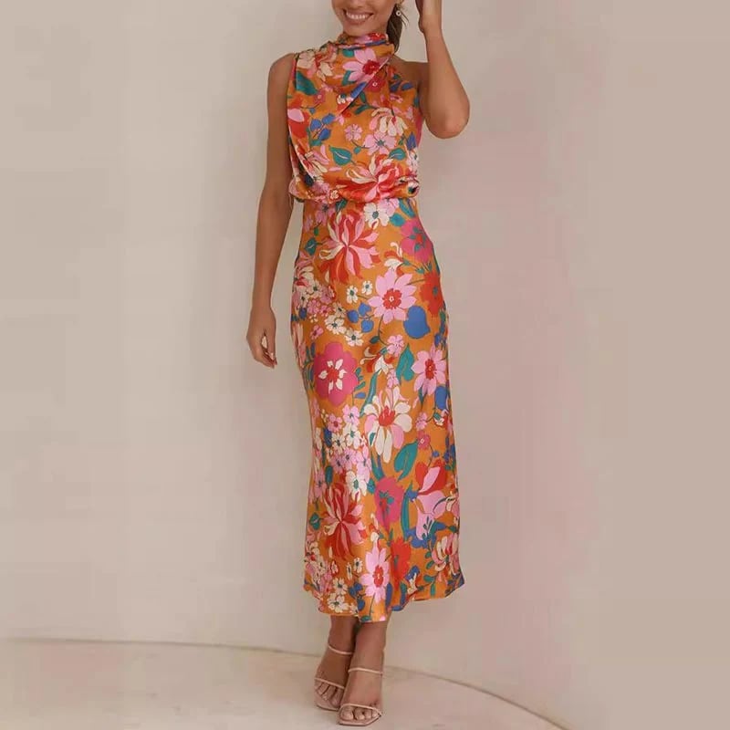 Ermeløs knytehalstrykk i sateng med halterneck og elastisk midje og maxikjole