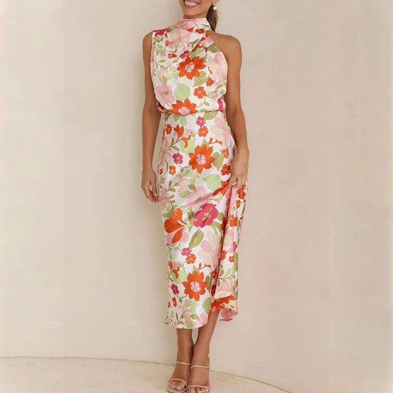 Ermeløs knytehalstrykk i sateng med halterneck og elastisk midje og maxikjole