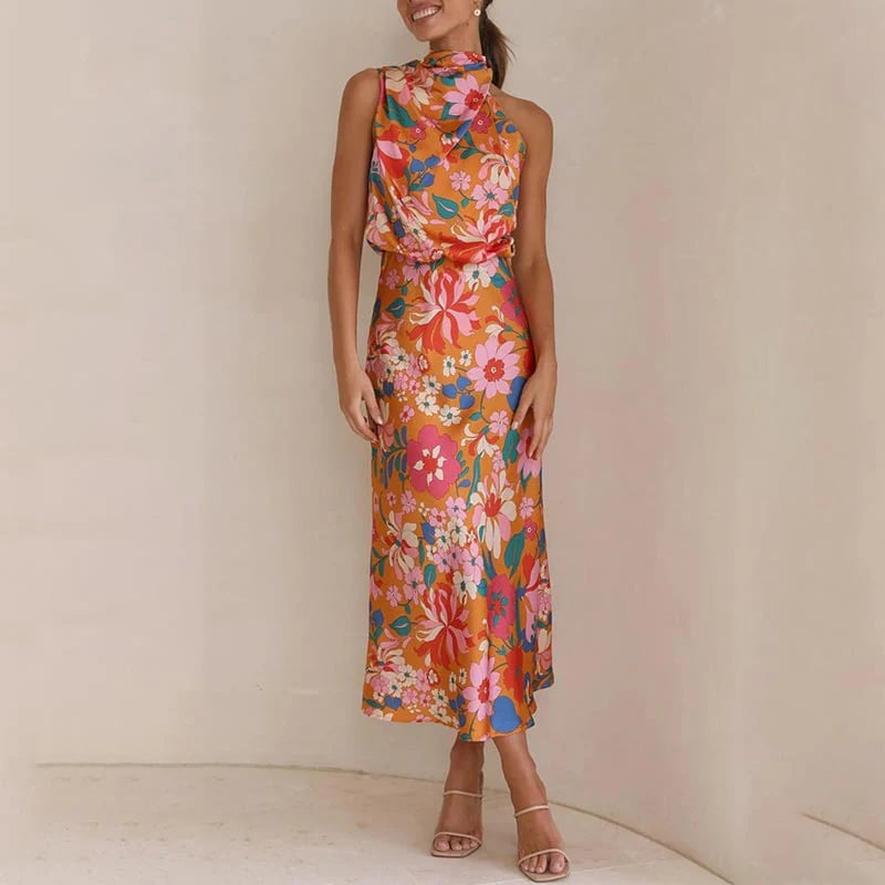 Ermeløs knytehalstrykk i sateng med halterneck og elastisk midje og maxikjole